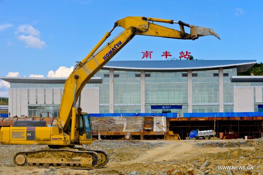 Photo taken on July 18, 2013 shows the Nanfeng train station under construction on Xiangtang-Putian Railway, or Xiangpu Railway, east China's Jiangxi Province. The 632-kilometer-long railway, which links Xiangtang Township in Nanchang, capital of Jiangxi, and Putian City in southeast China's Fujian Province, is expected to open to traffic by the end of this September after all debugging and commissioning finishes. The Xiangpu Railway, which will be one of the key transportation arteries for both travellers and goods in this area after it is opened to traffic, will also be the first railway running through seven districts and counties in Jiangxi and Fujian. (Xinhua/Chen Chunyuan)