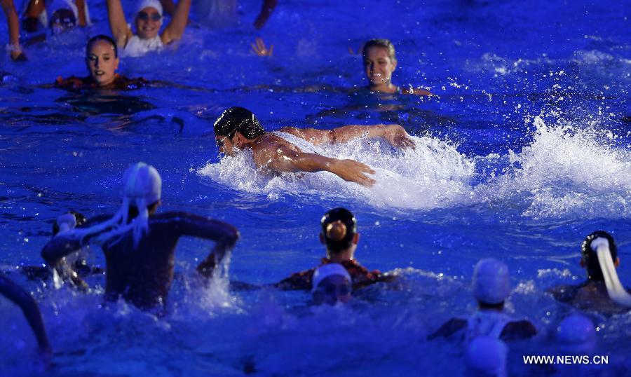 Swimmers perform during the Opening Ceremony of the 15th FINA World Championships at Palau Sant Jordi in Barcelona, Spain on July 19, 2013. (Xinhua/Wang Lili)