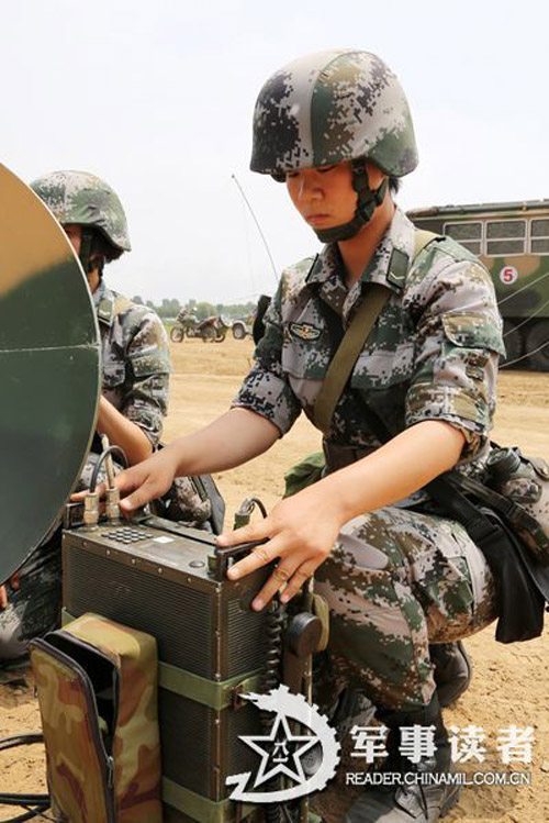 Female soldiers in a communication detachment of a brigade under the Jinan Military Area Command (MAC) of the Chinese People's Liberation Army (PLA) are in a communication exercises in a field training ground in mid July.  (China Military Online/Yu Hualiang, Yan Xiaohui, Jiang Honglin) 