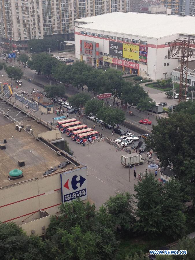 Photo taken on July 22, 2013 shows the outdoor scene of a Carrefour store where a knife attack occurred in Beijing, capital of China. A knife-wielding man allegedly injured four people, including two children, on Monday in the Carrefour store. (Xinhua/Ma Jing)