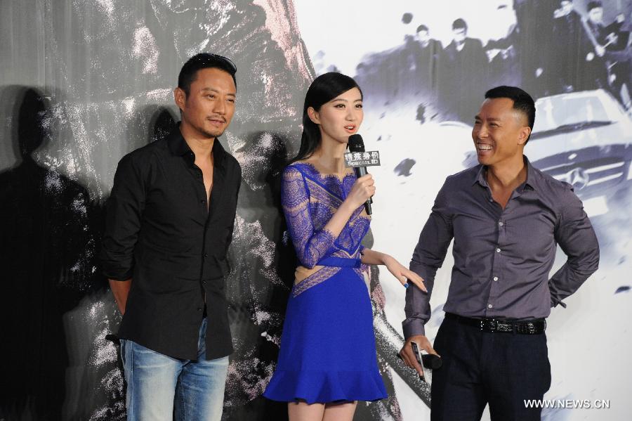 Actor Zhang Hanyu (L), actress Jing Tian (M) and actor Donnie Yen (R) attend the press conference of the movie "Special Identity" in Beijing, capital of China, July 22, 2013. The movie "Special Identity" will be screened in October. (Xinhua)