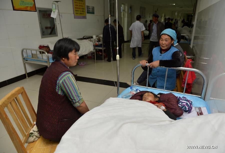 An injured child receives treatment at a hospital in Minxian County, northwest China's Gansu Province, July 22, 2013. The death toll has climbed to 89 in the 6.6-magnitude earthquake which jolted a juncture region of Minxian County and Zhangxian County in Dingxi City Monday morning. (Xinhua/Liu Xiao) 