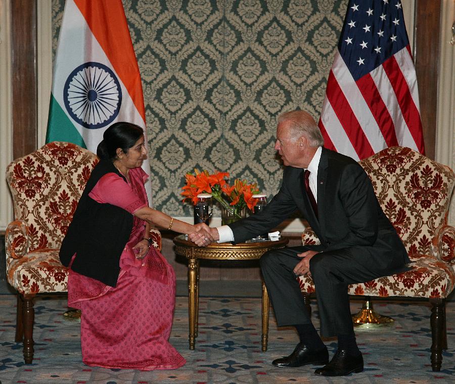U.S. Vice President Joe Biden (R) shakes hands with Sushma Swaraj, leader of India's opposition Bharatiya Janata Party (BJP) in Lok Sabha (the Lower House of Parliament), before a meeting at a hotel in New Delhi, India, July 23, 2013. Biden arrived in India on Monday for a four-day visit. (Xinhua/Partha Sarkar)
