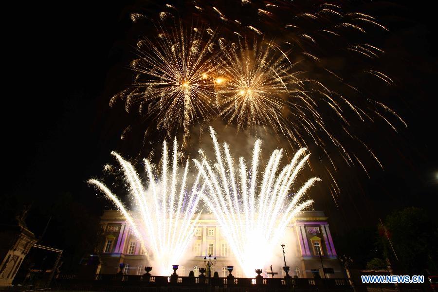 Fireworks are seen over the Royal Palace in Brussels, capital of Belgium, on the country's National Day, July 21, 2013. Crown Prince Philippe ascended to the Belgian throne on Sunday, after his father Albert II abdicated. (Xinhua/Gong Bing)
