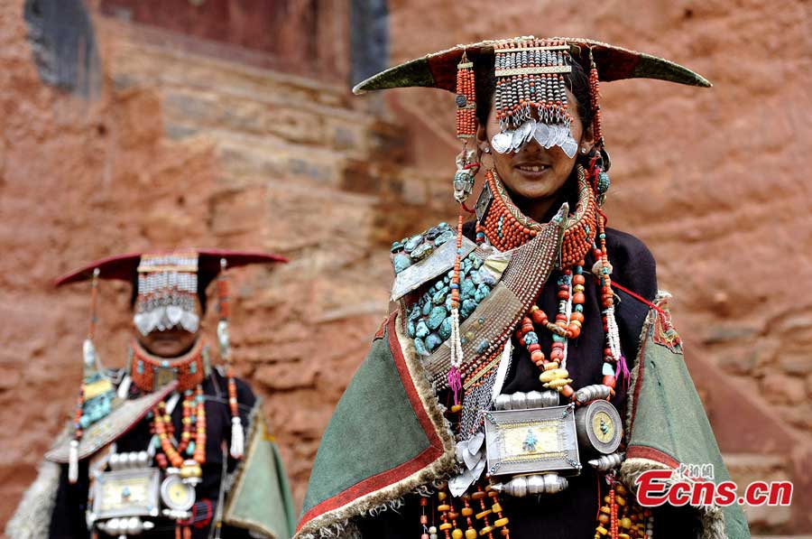 Tibetan women in traditional 'peacock costume' in a village of Burang County, Ngari Prefecture.(CNS/Li Lin)