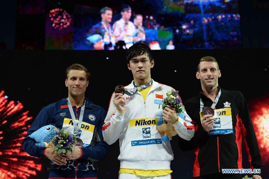 Gold medallist Sun Yang (C) of China poses with silver medallist Michael McBroom (L) of the United States and bronze medallist Ryan Cochrane of Canada during the awarding ceremony of the men's 800m freestyle final of the swimming competition at the 15th FINA World Championships in Barcelona, Spain on July 31, 2013. Sun Yang won the gold medal with 7 minutes and 41.36 seconds. (Xinhua/Guo Yong)