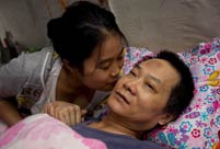 A girl takes care of paralyzed father for 10 years