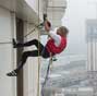 French Spiderman Alain Robert climbs up Galaxy Hotel in Macao