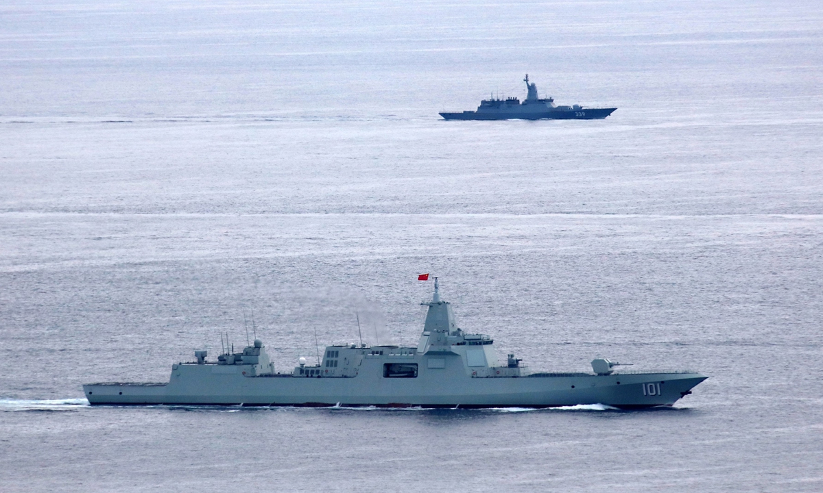 Chinese guided-missile destroyer Nanchang sails alongside a Russian frigate. Photo: Li Tang 