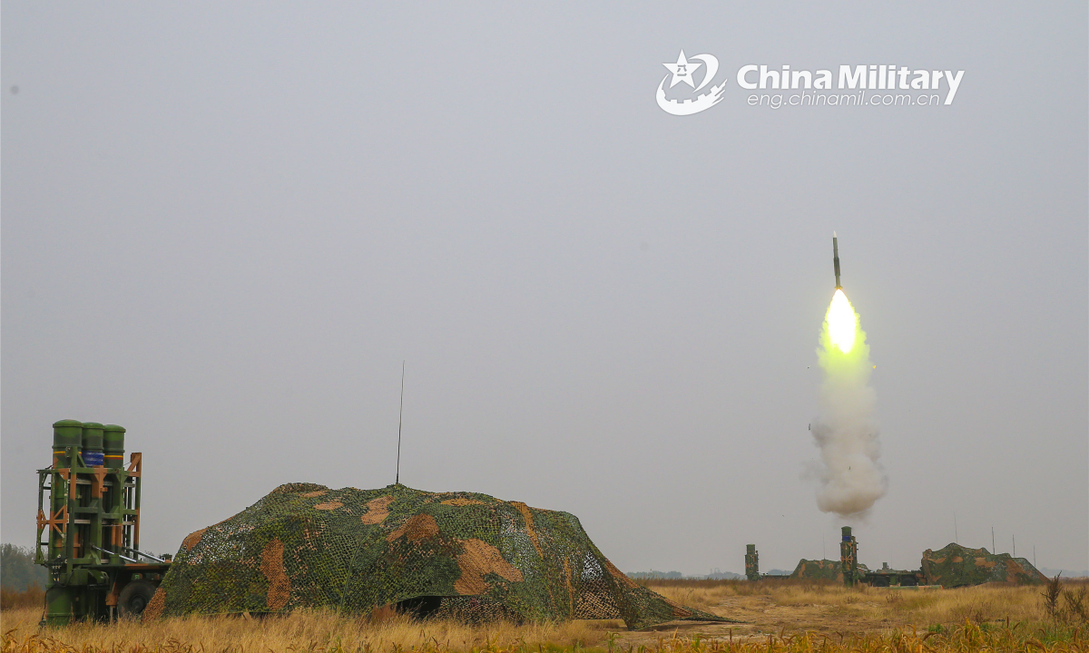 An air-defense missile system attached to a brigade under the PLA 71st Group Army launches an air-defense missile at a mock target during a field live-fire training exercise in late February, 2022. (eng.chinamil.com.cn/Photo by Xue Weigao)