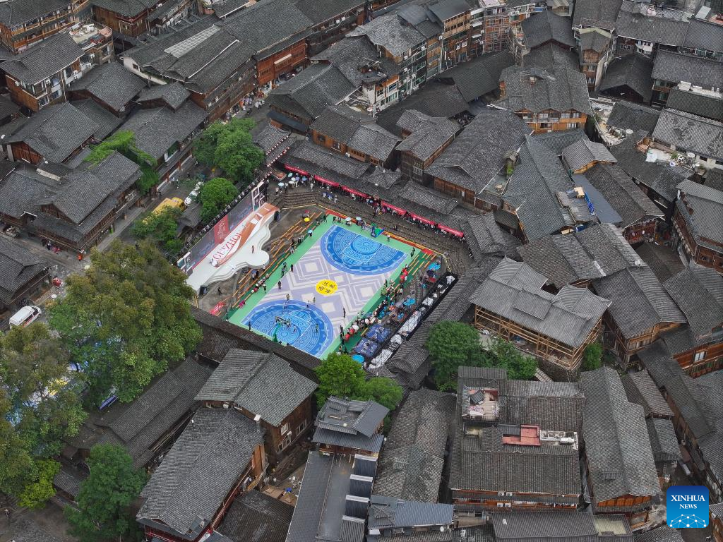 SW China's village holds activities to welcome tourists during May Day holiday